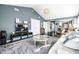 Spacious living room with vaulted ceilings, stylish furniture, and seamless kitchen access at 1720 Justin Ct, Indianapolis, IN 46219