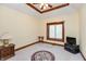 Bedroom with beige carpet, a ceiling fan and an area rug is staged with TV, side tables, and window at 1853 Water Oak Ct, Avon, IN 46123