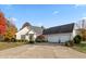 Stunning brick home featuring a spacious driveway, manicured landscaping and a three-car garage at 1853 Water Oak Ct, Avon, IN 46123