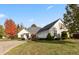 Beautiful brick home with lush green lawn, mature trees, and a three-car garage at 1853 Water Oak Ct, Avon, IN 46123