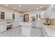 Bright kitchen features white cabinets, an island, stainless steel appliances and granite countertops at 1853 Water Oak Ct, Avon, IN 46123