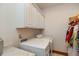 Laundry room with front load machines, granite countertops, and overhead cabinets at 1853 Water Oak Ct, Avon, IN 46123