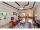 Open living space with hardwood floors, custom ceiling, fireplace and arched doorway at 1853 Water Oak Ct, Avon, IN 46123