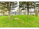 Spacious backyard with lush green grass and mature trees at 1965 Churchill Rd, Franklin, IN 46131