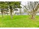 Inviting backyard with green grass, established trees, and a peaceful ambiance at 1965 Churchill Rd, Franklin, IN 46131