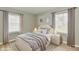 Staged bedroom featuring a cozy bed and a calm, neutral color palette at 1965 Churchill Rd, Franklin, IN 46131