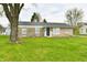 Charming single-story home with stone exterior and well-manicured front lawn at 1965 Churchill Rd, Franklin, IN 46131