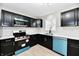 Well-lit kitchen with new appliances, updated cabinets, and stylish backsplash at 1965 Churchill Rd, Franklin, IN 46131