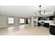 Living room with access to the kitchen, offering open space and modern lighting at 1965 Churchill Rd, Franklin, IN 46131