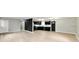 Open-concept living space with sleek floors connecting to the updated kitchen at 1965 Churchill Rd, Franklin, IN 46131