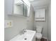 Bathroom with a vanity sink, medicine cabinet, and a toilet at 2109 N Janney Ave, Muncie, IN 47304