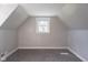 Cozy bedroom with carpeted floors and a window offering ample natural light at 2109 N Janney Ave, Muncie, IN 47304