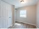 Bedroom with wood floors and a closet, illuminated by natural light from a window at 2109 N Janney Ave, Muncie, IN 47304
