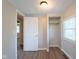 Cozy bedroom with wood floors, a closet, and a window letting in natural light at 2109 N Janney Ave, Muncie, IN 47304