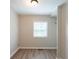 Light-filled bedroom with wood flooring, a closet, and a window at 2109 N Janney Ave, Muncie, IN 47304