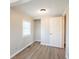 Bedroom featuring wood floors and natural light from a window at 2109 N Janney Ave, Muncie, IN 47304