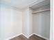 A practical walk-in closet with a sturdy hanging rod offers ample storage space and organizational potential at 2109 N Janney Ave, Muncie, IN 47304