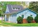 Charming single-Gathering home featuring blue siding, brick accents, and a well-maintained front yard at 2109 N Janney Ave, Muncie, IN 47304