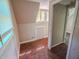 Carpeted hallway featuring natural light, connecting various spaces within the home at 2109 N Janney Ave, Muncie, IN 47304