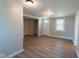 Open living room with wood flooring, natural light, and access to a closet at 2109 N Janney Ave, Muncie, IN 47304