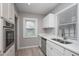 Updated kitchen with stainless steel dishwasher and sink beneath a window at 217 W 35Th St, Indianapolis, IN 46208