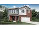 Charming two-story home featuring a brick facade, siding, a two-car garage, and a well-manicured lawn at 2209 Boxwood Dr, Greenfield, IN 46140