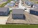 Rear aerial view of a two-story home with backyard and surrounding neighborhood under construction at 24517 Wallace St, Sheridan, IN 46069