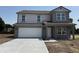 Charming two-story home with a two car garage and a concrete driveway at 24517 Wallace St, Sheridan, IN 46069