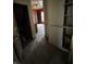 Hallway with built-in cabinets and an archway to a bedroom at 2657 E Riverside Dr, Indianapolis, IN 46208