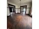 Open living room area with hardwood floors and vintage chandelier at 2657 E Riverside Dr, Indianapolis, IN 46208