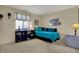 Bedroom featuring daybed with teal pillows, cuckoo clock and shelving unit at 2979 Amherst St, Indianapolis, IN 46268