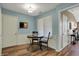 Cozy dining area with wood floors, a round table, and natural light at 2979 Amherst St, Indianapolis, IN 46268