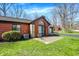 Rear of brick house with large windows and a concrete patio, perfect for outdoor living at 2979 Amherst St, Indianapolis, IN 46268