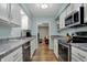 Well-lit kitchen boasts stainless steel appliances and stylish countertops at 2979 Amherst St, Indianapolis, IN 46268