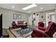 Bright living room showcases wood floors and easy access to kitchen and doorway at 2979 Amherst St, Indianapolis, IN 46268