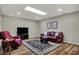 Cozy living room features a skylight, wood flooring, and comfortable seating at 2979 Amherst St, Indianapolis, IN 46268