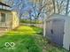 View of home with lawn, shed and a fenced-in yard at 301 Barton Ave, Indianapolis, IN 46241