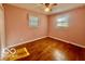 Bedroom with hardwood floors and natural light from the windows at 301 Barton Ave, Indianapolis, IN 46241