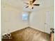 Neutral bedroom featuring a ceiling fan and natural light from a window at 301 Barton Ave, Indianapolis, IN 46241