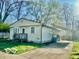 Cozy single-story home with a driveway and a well-maintained front lawn at 301 Barton Ave, Indianapolis, IN 46241