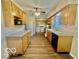 Well-lit kitchen featuring bright cabinets and updated appliances at 301 Barton Ave, Indianapolis, IN 46241