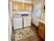 Convenient laundry area with washer and dryer, accessible from the kitchen at 301 Barton Ave, Indianapolis, IN 46241