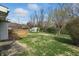 View of backyard, showcasing wooden deck and storage shed at 318 Camby St, Greenwood, IN 46142