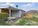 Rear exterior of home with concrete patio and wooden deck at 318 Camby St, Greenwood, IN 46142