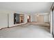 Open living room next to kitchen featuring raised platform and view to another living area at 318 Camby St, Greenwood, IN 46142