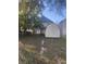 Backyard with lawn, utility shed, fence and mature tree at 3241 N Capitol Ave, Indianapolis, IN 46208