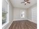 This bedroom features wood-look flooring and bright windows at 3241 N Capitol Ave, Indianapolis, IN 46208