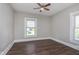 This bedroom features wood-look flooring and two windows at 3241 N Capitol Ave, Indianapolis, IN 46208