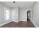 This bedroom features wood-look flooring and a bright window at 3241 N Capitol Ave, Indianapolis, IN 46208
