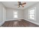 This bedroom features wood-look flooring and two windows at 3241 N Capitol Ave, Indianapolis, IN 46208